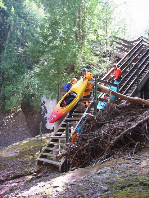 Hoisting the boats over the put in gate