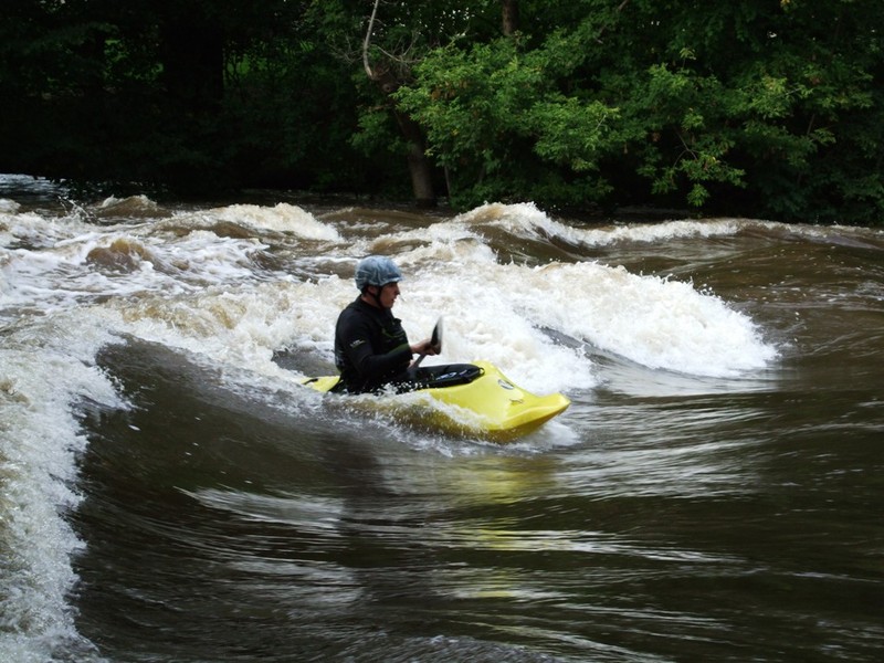 Kayak Surfing the Wave
