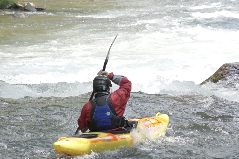 Kayaker entering the falls
