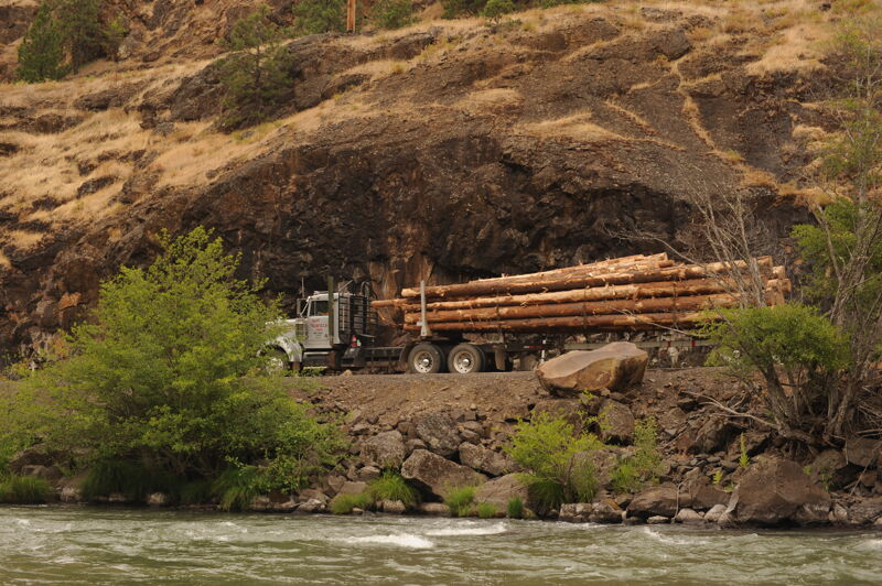 Log Truck Headed Downriver